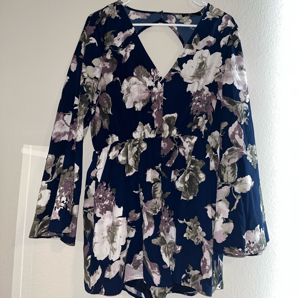 C. Luce -Navy blue and floral romper, backless, bell/wide sleeve